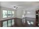 Open-concept living room with hardwood floors and seamless flow to the dining area at 2948 Goldfinch Cir, Marietta, GA 30066