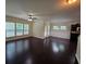 Living room with hardwood floors, windows and an open floor plan to the dining and kitchen at 2948 Goldfinch Cir, Marietta, GA 30066