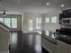 Open living area with hardwood floors, backyard access, and kitchen view at 2948 Goldfinch Cir, Marietta, GA 30066