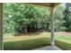 View of tranquil backyard from covered patio perfect for entertaining at 2948 Goldfinch Cir, Marietta, GA 30066