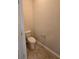 A simple toilet room features a standard toilet and tile flooring at 2948 Goldfinch Cir, Marietta, GA 30066