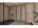 Modern bathroom featuring a black shower and neutral-toned marble walls at 1401 Rupert Rd, Decatur, GA 30030