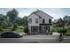 Charming two-story home with modern design, manicured landscaping, and welcoming curb appeal at 1401 Rupert Rd, Decatur, GA 30030