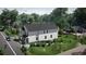 Modern two-story house featuring white siding, a dark roof, and well-maintained landscaping at 1401 Rupert Rd, Decatur, GA 30030