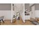 Hallway with hardwood floors, stylish decor, and ample natural light at 1401 Rupert Rd, Decatur, GA 30030