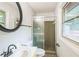 Bathroom with walk-in shower, sleek fixtures, and a contemporary mirror at 1526 Tanglewood Nw Way, Conyers, GA 30012