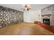 Spacious living room featuring a stone accent wall, fireplace, and soft carpeting at 1526 Tanglewood Nw Way, Conyers, GA 30012