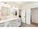 Bright bathroom featuring double vanity with brass hardware, and gold framed mirrors at 160 Winner St, Acworth, GA 30102