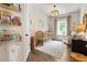 Cozy Bedroom with neutral tones, wooden crib, and shelving with books at 160 Winner St, Acworth, GA 30102