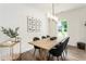 Stylish dining room with contemporary decor, a bright window, and wood flooring at 160 Winner St, Acworth, GA 30102