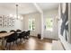 Light-filled dining room with wood floors, a stylish chandelier, and modern decor at 160 Winner St, Acworth, GA 30102