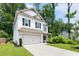 Beautiful two-story home featuring a well-maintained lawn, driveway, and an attached garage at 160 Winner St, Acworth, GA 30102