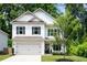 Inviting two-story home with a well-manicured lawn and an attached two-car garage at 160 Winner St, Acworth, GA 30102