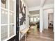Bright foyer featuring wood floors, a bench, and a view into the adjacent living spaces at 160 Winner St, Acworth, GA 30102