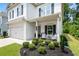 Home with a beautifully landscaped front yard, covered porch, and an attached garage at 160 Winner St, Acworth, GA 30102
