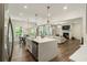 Modern kitchen with quartz countertops, stainless steel appliances, and an open layout at 160 Winner St, Acworth, GA 30102
