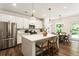 Modern kitchen featuring an island with bar seating and stainless steel appliances at 160 Winner St, Acworth, GA 30102
