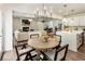 Open-concept living and dining area with modern lighting and a fireplace at 160 Winner St, Acworth, GA 30102
