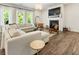 Spacious living room with fireplace, large windows, and comfortable sectional sofa at 160 Winner St, Acworth, GA 30102