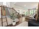 Bright and airy living room with hardwood floors, open layout, and modern staircase at 160 Winner St, Acworth, GA 30102