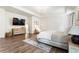 Comfortable main bedroom with hardwood floors, decor, soft lighting, and a TV on the wall at 160 Winner St, Acworth, GA 30102