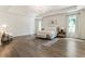 Spacious main bedroom features a tray ceiling, two windows and soft natural light at 160 Winner St, Acworth, GA 30102