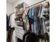 Organized walk-in closet with built-in shelving and hanging rods at 160 Winner St, Acworth, GA 30102