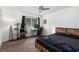 Comfortable bedroom with ceiling fan, desk, and modern shelving at 1701 Wiscasset Pl, Tucker, GA 30084