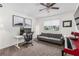 Bright bedroom featuring a desk, sofa, and keyboard piano, ideal for relaxing and creative work at 1701 Wiscasset Pl, Tucker, GA 30084