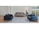 Comfortable living room with large windows, plush seating, and natural light at 1701 Wiscasset Pl, Tucker, GA 30084