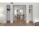 Open floor plan featuring built-in bookshelves and hardwood floors throughout at 1701 Wiscasset Pl, Tucker, GA 30084