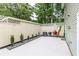 Back patio ideal for grilling, features a spacious patio area with privacy fence at 1701 Wiscasset Pl, Tucker, GA 30084