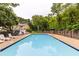 Inviting community pool with lounge chairs and lush landscaping offering a refreshing outdoor space at 1701 Wiscasset Pl, Tucker, GA 30084