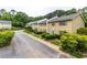 Charming townhomes featuring manicured landscaping and vibrant exteriors along quiet street at 1701 Wiscasset Pl, Tucker, GA 30084