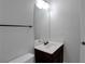 Half bathroom with vanity and white fixtures at 5123 Jack Dr, Decatur, GA 30035