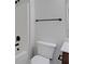 Bathroom featuring shower, toilet, and dark fixtures at 5123 Jack Dr, Decatur, GA 30035