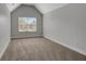 Bright bedroom with large window, neutral walls, and carpeted floor at 5123 Jack Dr, Decatur, GA 30035