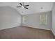 Large bedroom with vaulted ceiling, natural light, and ceiling fan at 5123 Jack Dr, Decatur, GA 30035