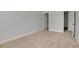 Neutral bedroom with carpet flooring, white trim, and two white doors at 5123 Jack Dr, Decatur, GA 30035