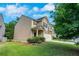 Charming two-story home with stone accents, a two-car garage and well-maintained lawn at 5123 Jack Dr, Decatur, GA 30035
