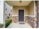 Inviting front porch featuring stone accents and a stylish front door at 5123 Jack Dr, Decatur, GA 30035