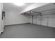 Clean, spacious garage with gray painted floor, automatic opener, and ample room for parking at 5123 Jack Dr, Decatur, GA 30035