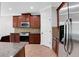 Bright kitchen featuring stainless steel appliances, granite counters, and tile floors at 5123 Jack Dr, Decatur, GA 30035