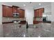 Gourmet kitchen featuring granite countertops and stainless steel appliances at 5123 Jack Dr, Decatur, GA 30035