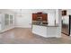 Modern kitchen with stainless steel appliances and ample cabinet space open to dining area at 5123 Jack Dr, Decatur, GA 30035