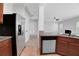 Spacious kitchen with stainless appliances, granite counters, and tile flooring at 5123 Jack Dr, Decatur, GA 30035