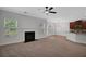 Open-concept living space with a fireplace seamlessly connected to the kitchen at 5123 Jack Dr, Decatur, GA 30035