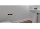 Powder room with pedestal sink and neutral finishes at 5123 Jack Dr, Decatur, GA 30035