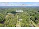 Aerial view of an Austell, GA home near Butternut Creek, surrounded by lush greenery and a peaceful neighborhood at 1582 Pine Cir, Austell, GA 30168