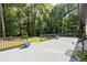 This spacious back deck with planters and black railings is perfect for entertaining at 1582 Pine Cir, Austell, GA 30168